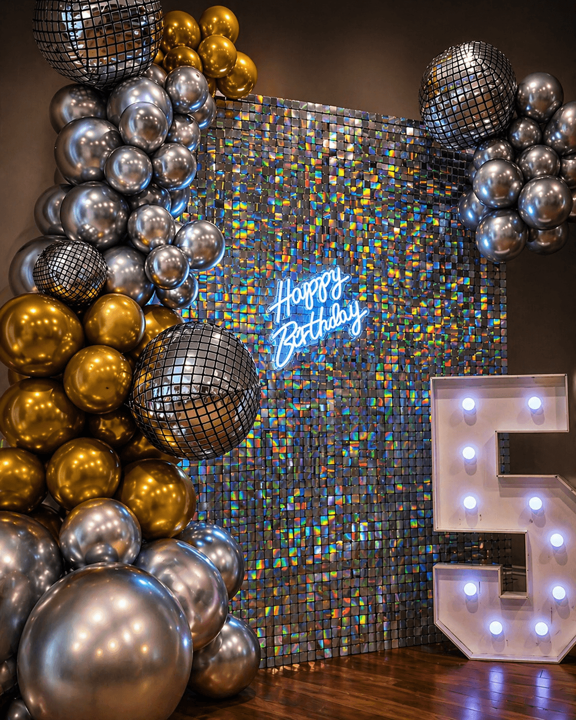 Statement balloon backdrop with shimmer wall and metallic styling for a premium gallery feature