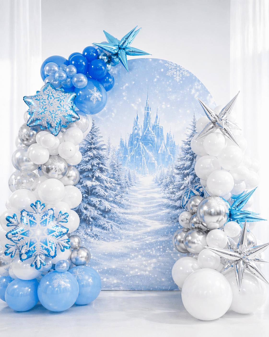 Winter-inspired blue and white balloon backdrop for a children's birthday