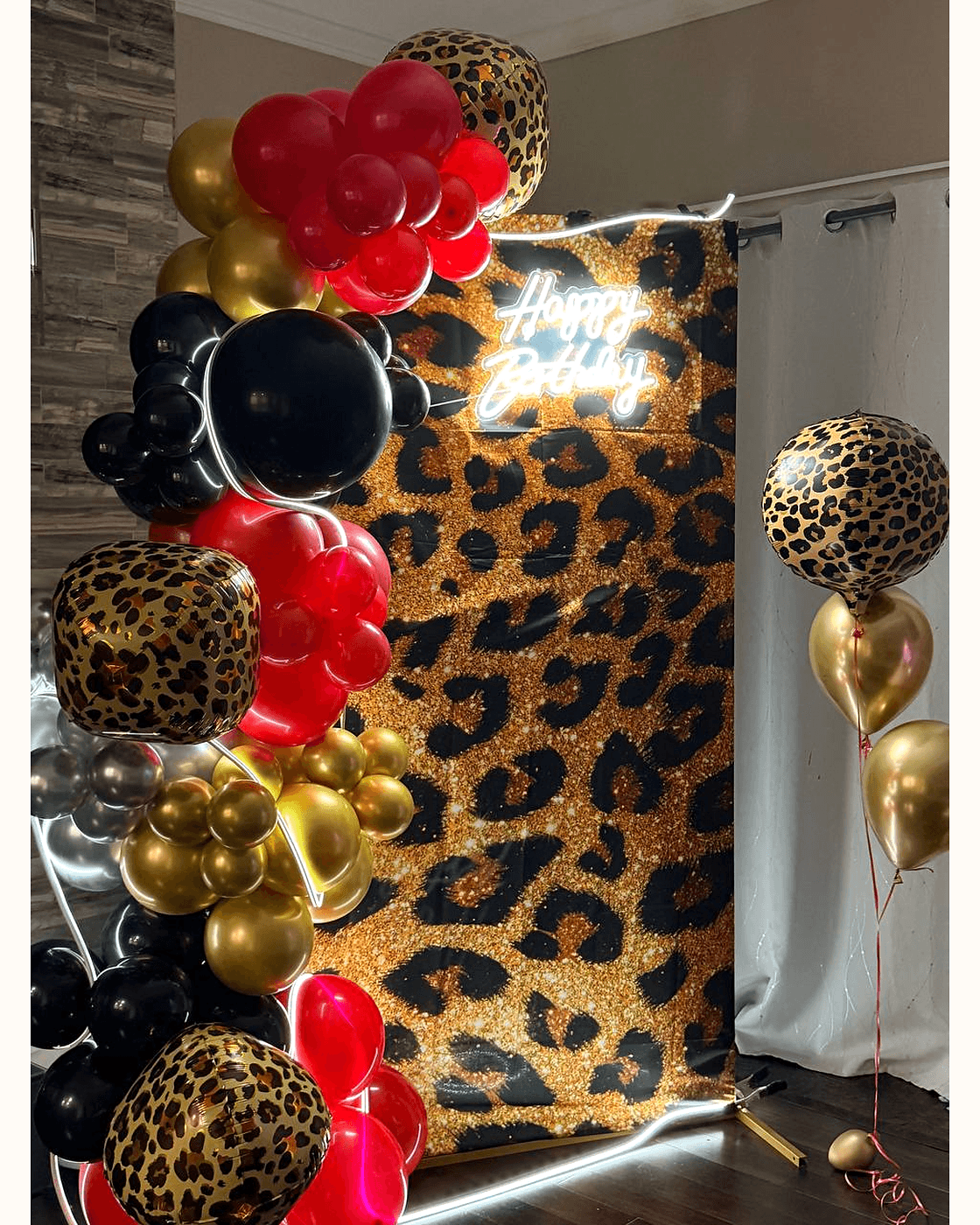 Leopard themed birthday balloon backdrop