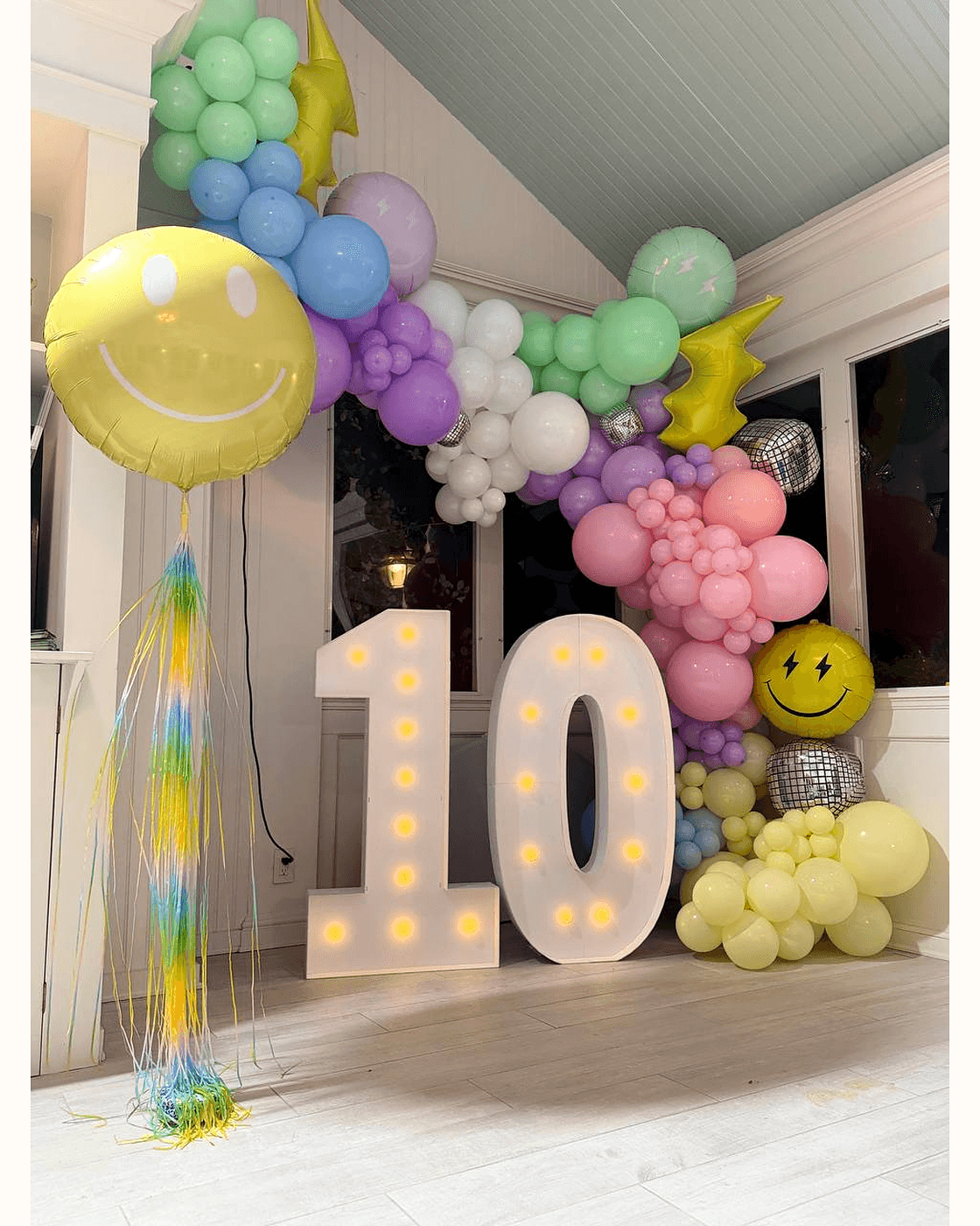 Pastel balloon garland with marquee numbers